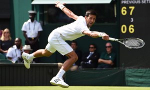 epa05394309 Novak Djokovic of Serbia returns to Britain's James Ward in their first round match of the Wimbledon Championships at the All England Lawn Tennis Club, in London, Britain, 27 June 2016.  EPA/GERRY PENNY EDITORIAL USE ONLY/NO COMMERCIAL SALES