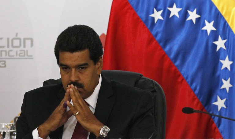 Venezuela's interim President Nicolas Maduro sits as he waits for the official ceremony at the Electoral Council to certify his victory on Sunday's presidential election in Caracas, Venezuela, Monday, April 15, 2013. Venezuela's government-friendly electoral council has quickly certified the razor-thin presidential victory of Hugo Chavez' hand-picked successor. Nicolas Maduro was elected by a margin of 50.8 percent to 49 percent over challenger Henrique Capriles.(AP Photo/Ariana Cubillos)