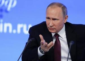 Russian President Vladimir Putin gestures during his annual news conference in Moscow, Russia, Friday, Dec. 23, 2016. Putin expressed hope that he would meet soon with Trump to discuss how to improve the two countries' relations. (AP Photo/Pavel Golovkin)